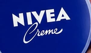 1. Cream tin: readable words are not an exact wordmark: enlarged first attempt label crop
