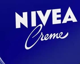 1. Cream tin: readable words are not an exact wordmark: enlarged source label crop