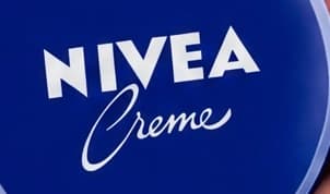 1. Cream tin: readable words are not an exact wordmark: enlarged repair label crop
