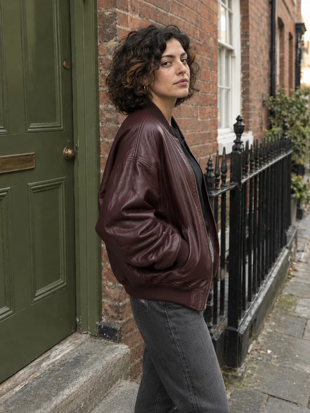 After, photo 3: Side-Angle Shot, same fictional adult, burgundy outfit and brick-street location