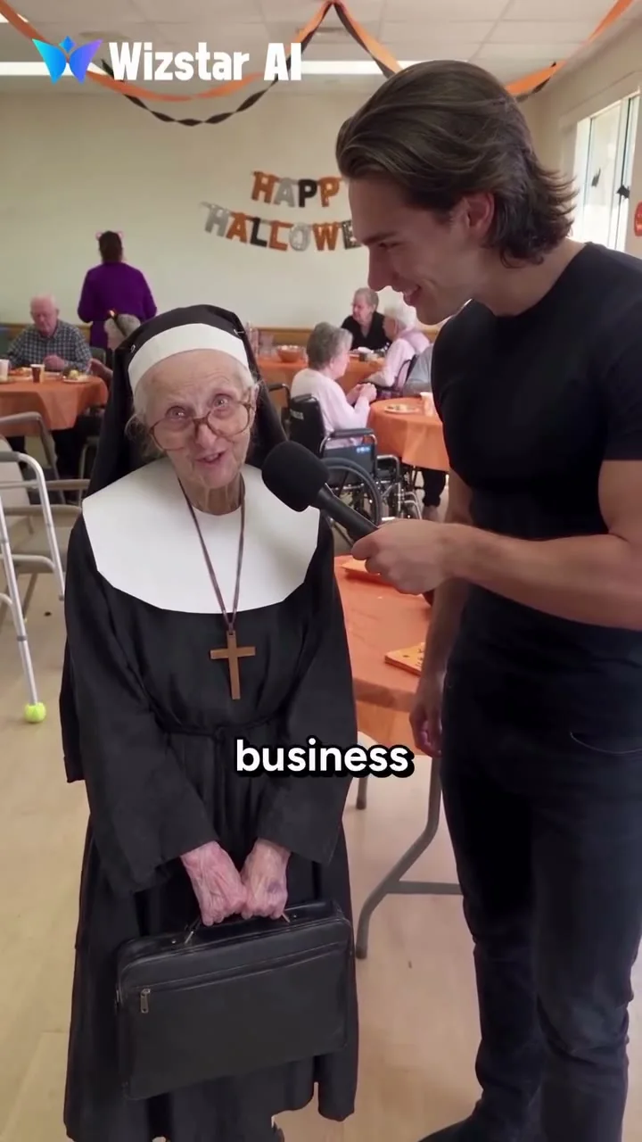 Source-video frame at 13.8 seconds: a nun-costumed guest holds a briefcase while Joey interviews her; the original business subtitle and Wizstar AI credit remain visible