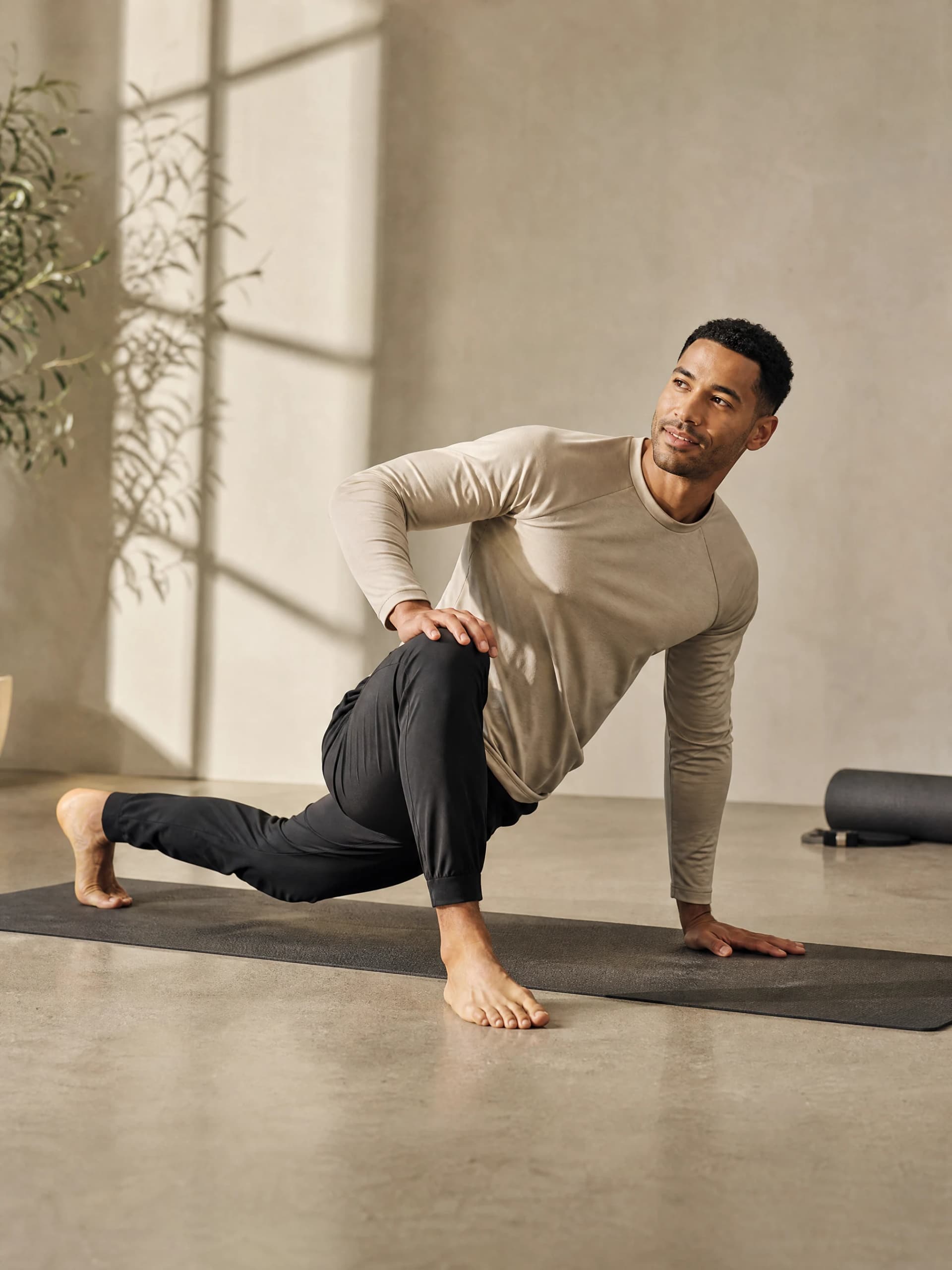 Fictional adult creator practicing a controlled mobility pose