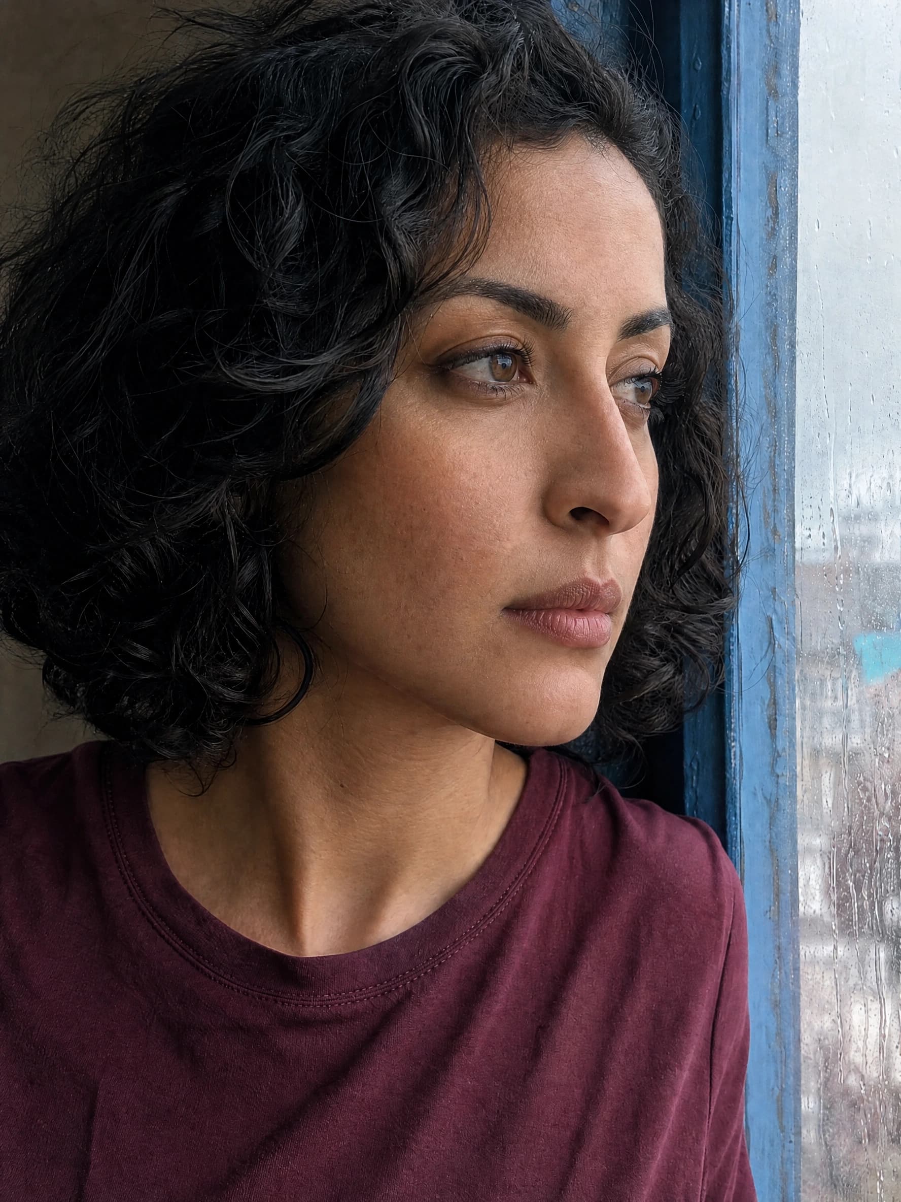 Fictional adult woman beside a rainy window, actual skin texture editing result