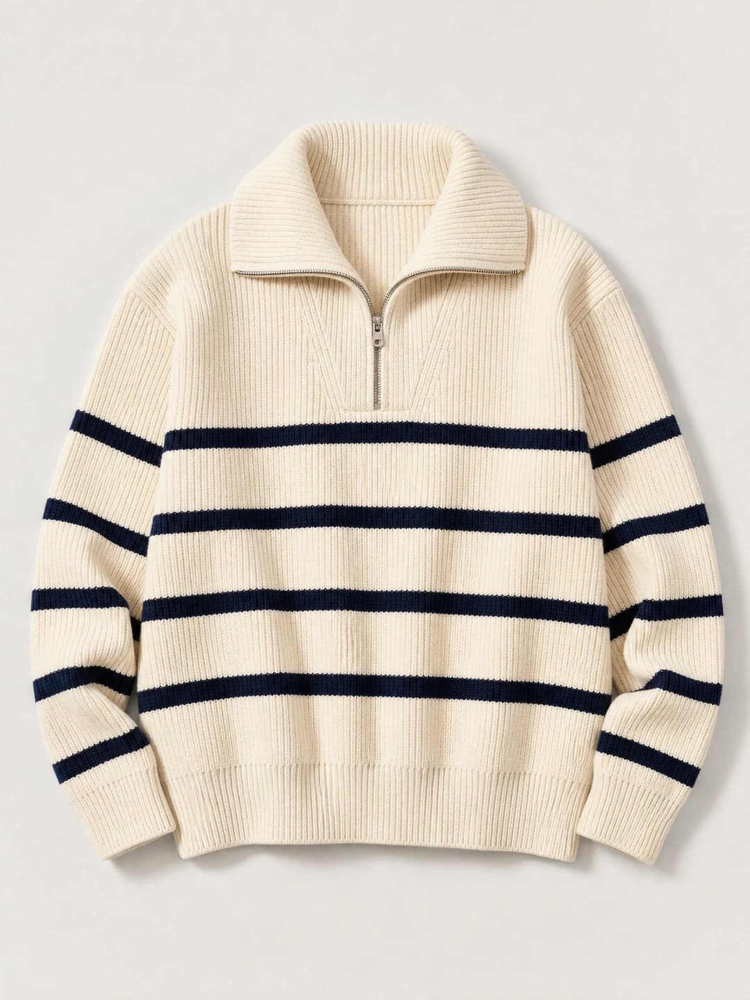 Fictional cream ribbed zip-neck knit with navy engineered stripes photographed as a garment reference.