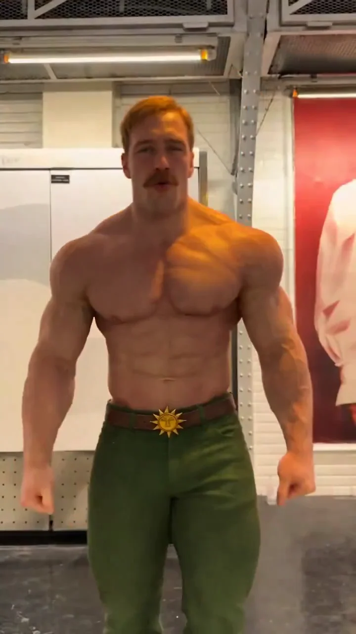 Escanor source video at ten seconds showing a closer frontal view, muscular silhouette and sun-shaped buckle