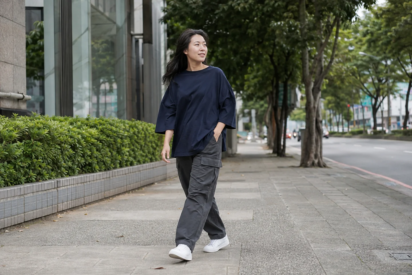 An original fictional adult creator walking in casual streetwear.