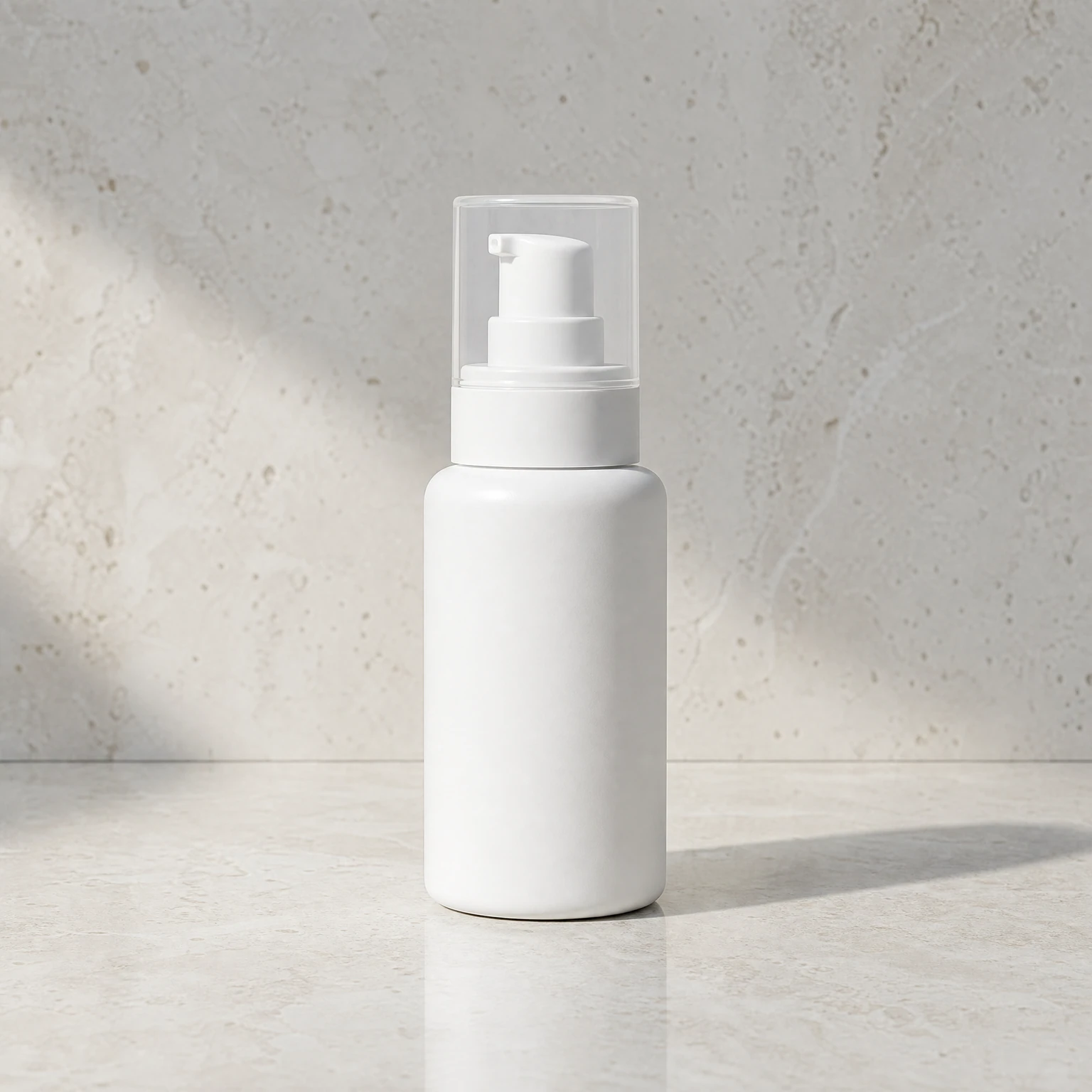Square source photo of one fictional unbranded white skincare pump bottle.