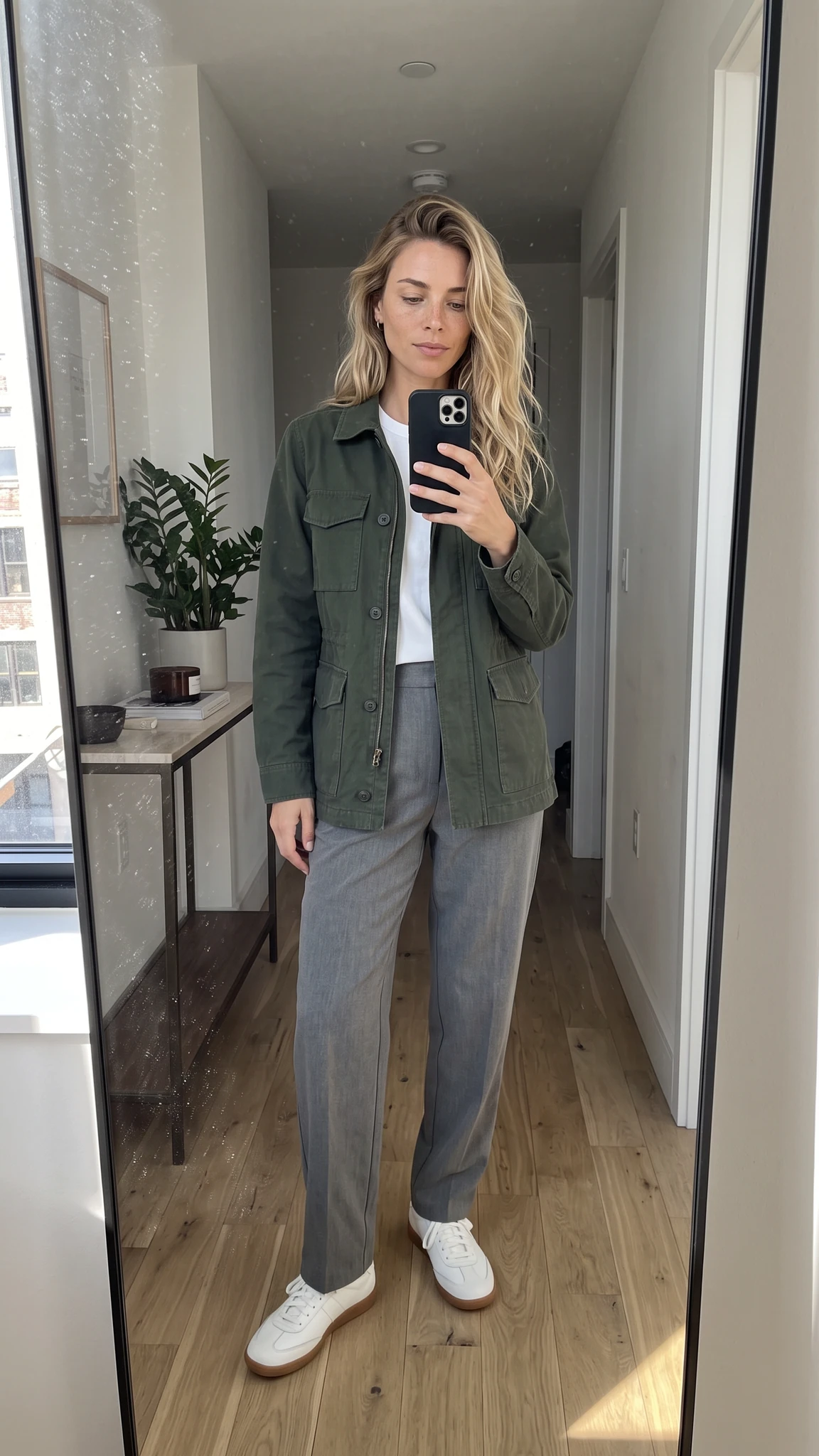 A fictional adult AI influencer taking a full-length mirror fit-check selfie.