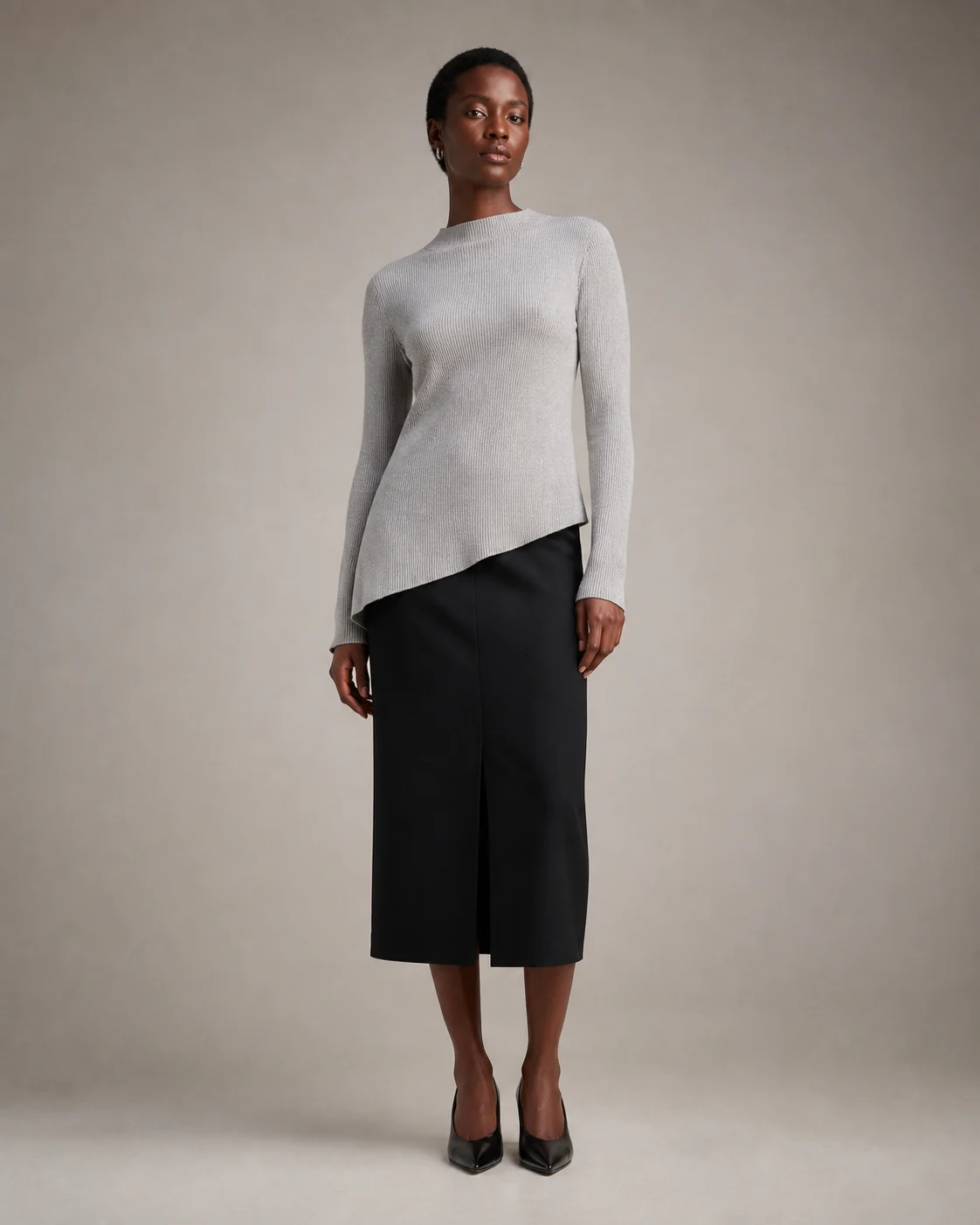 Fictional adult Black fashion model wearing an original silver knit and black tailored skirt in a studio lookbook concept.