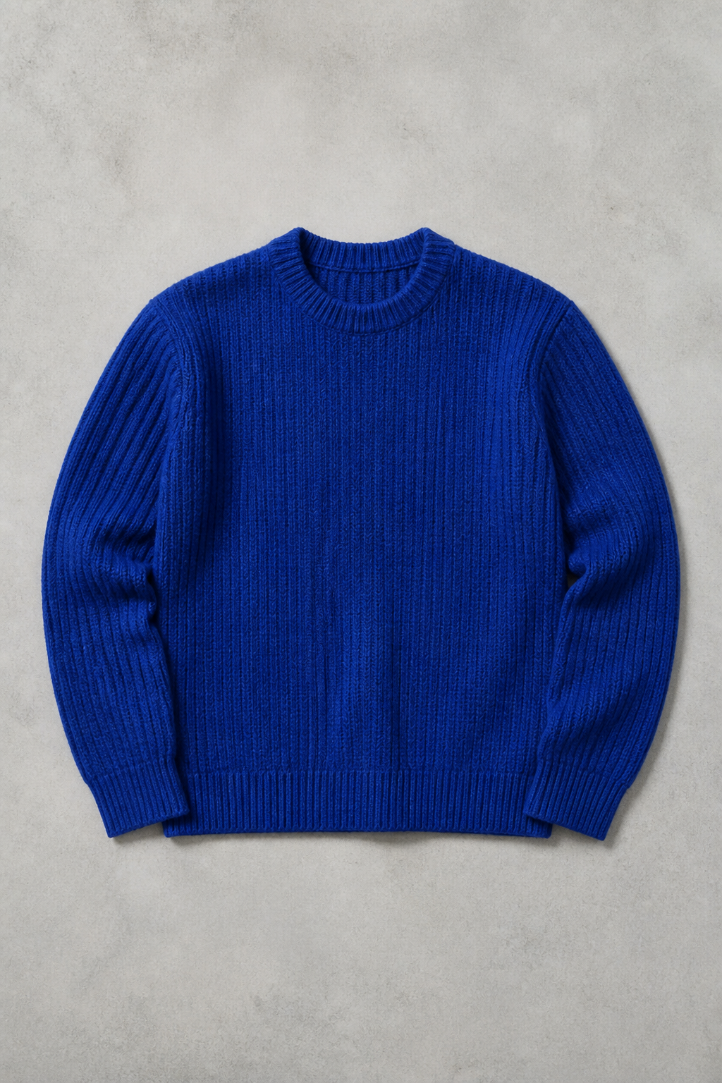 Fictional unbranded cobalt blue ribbed knit sweater flat lay.