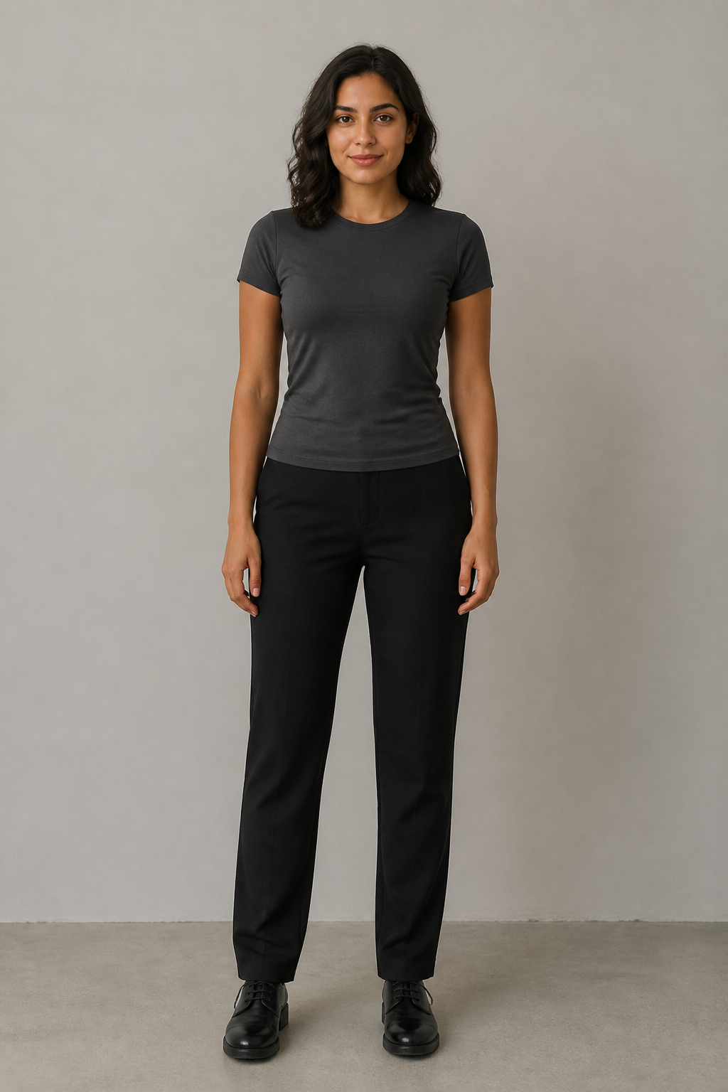 Fictional adult source person in a charcoal tee and black trousers.
