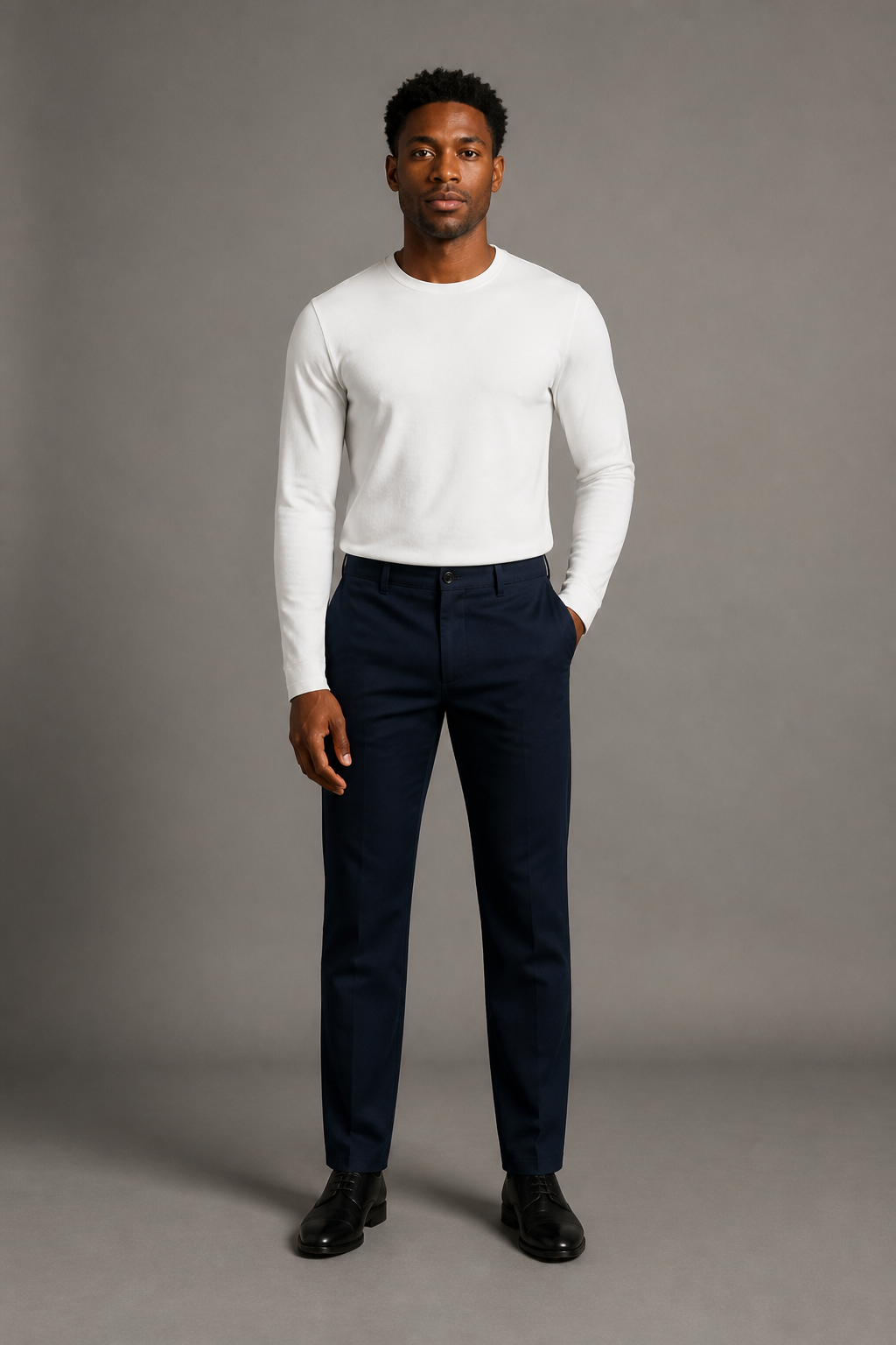Fictional adult source person in a white shirt and navy trousers.