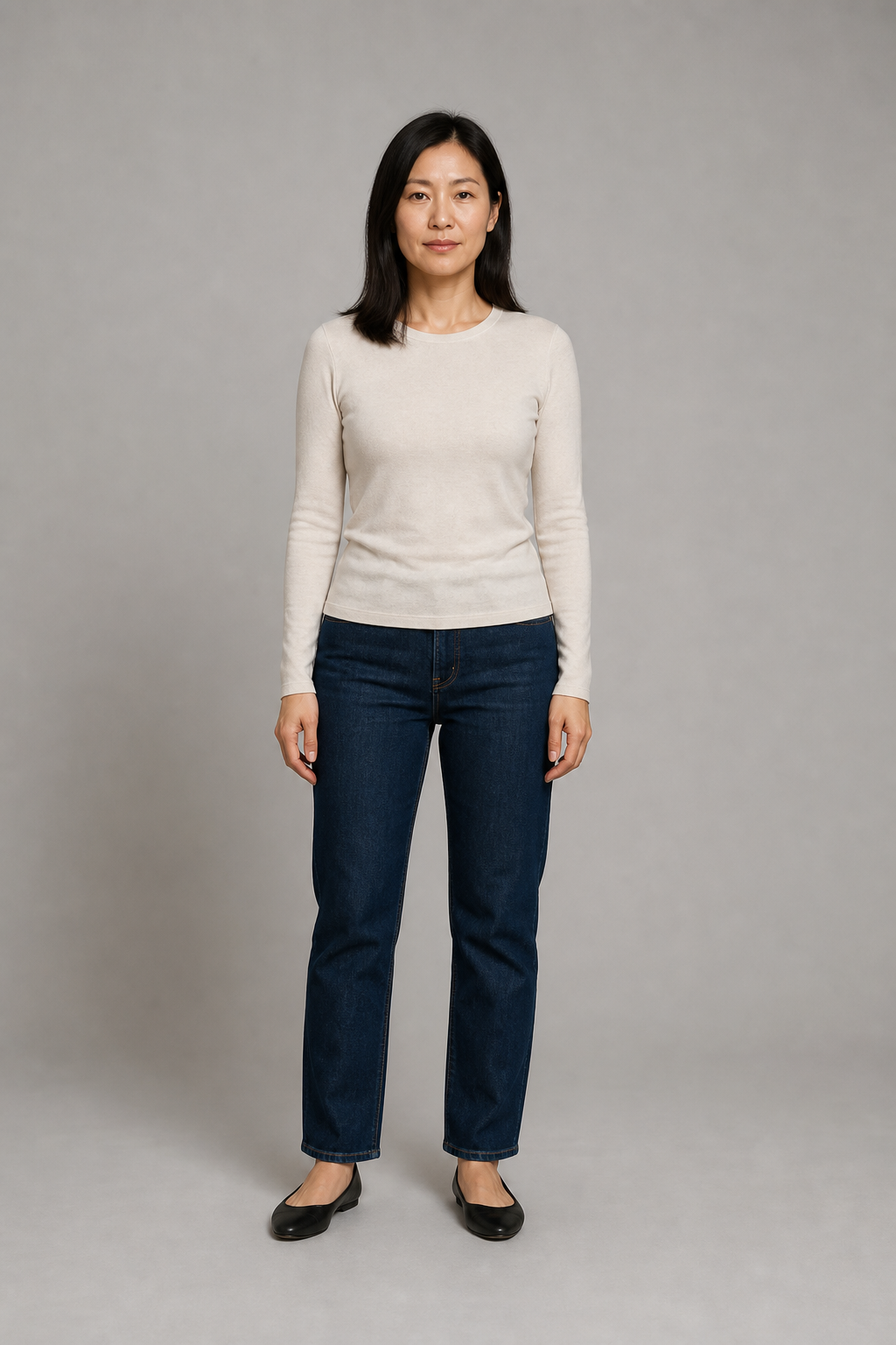 Fictional adult source person in a stone top and dark jeans.
